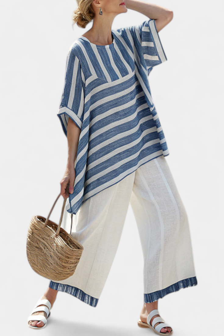 Elegant linen set in Mediterranean style with blue stripes and finished-bottom trousers for a fresh and stylish look