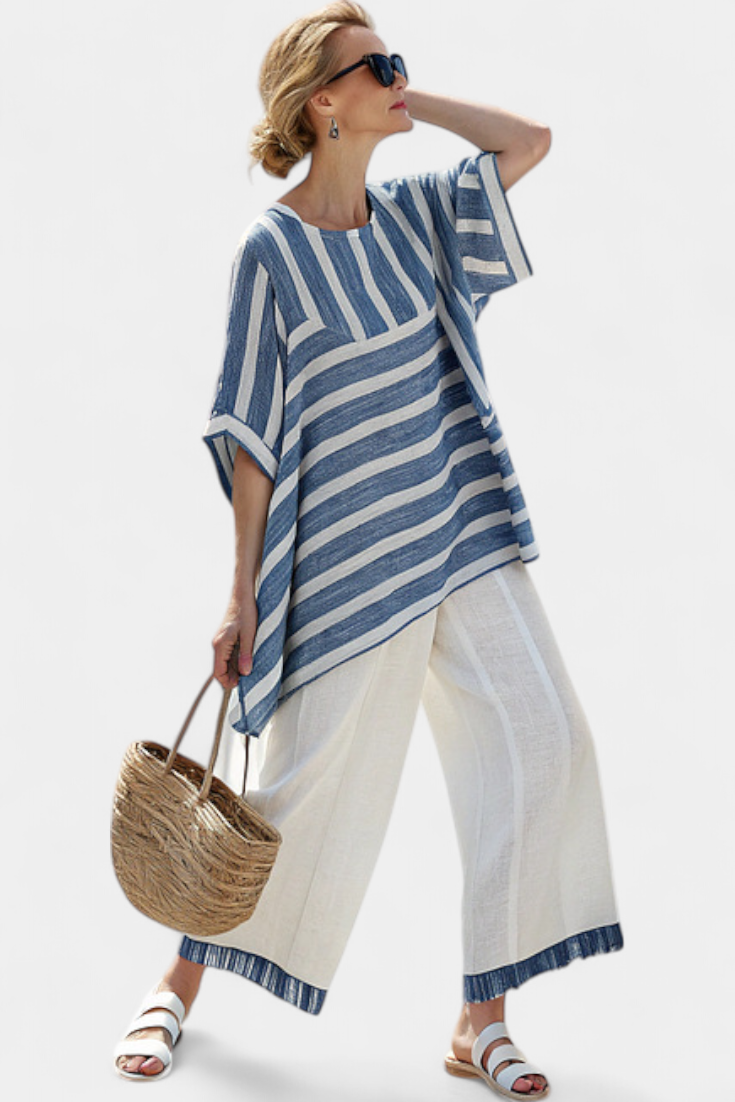 Elegant linen set in Mediterranean style with blue stripes and finished-bottom trousers for a fresh and stylish look
