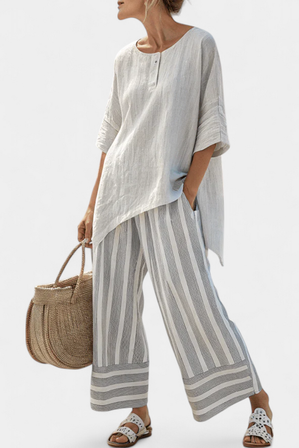 Daisy Set with Asymmetrical Top and Striped Pants for a Modern and Elegant Style